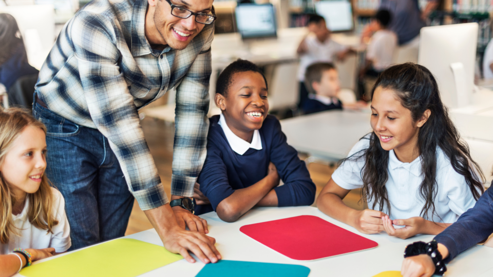 Teacher working with students