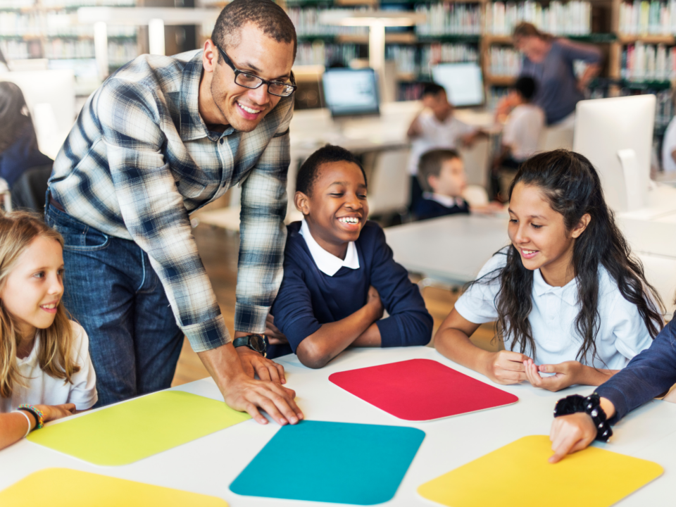 Teacher working with students