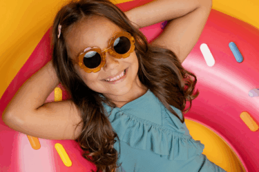 girl on pool float for easy summer crafts