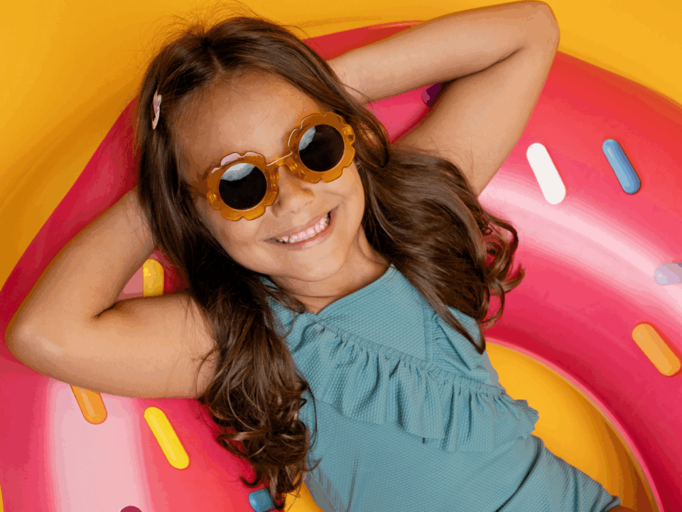 girl on pool float for easy summer crafts