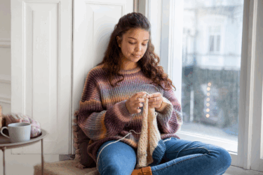 girl knitting as a form of rest