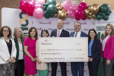 woman's hospital presenting check for southeastern's nursing and simulation lab