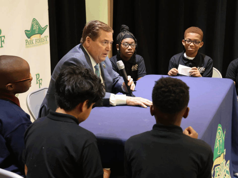 lt. gov sitting with students at park forest