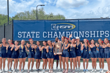 st. joseph's tennis team posing with trophy from state title
