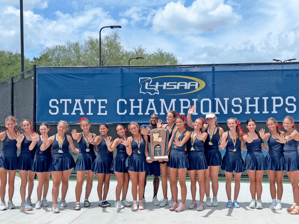 st. joseph's tennis team posing with trophy from state title