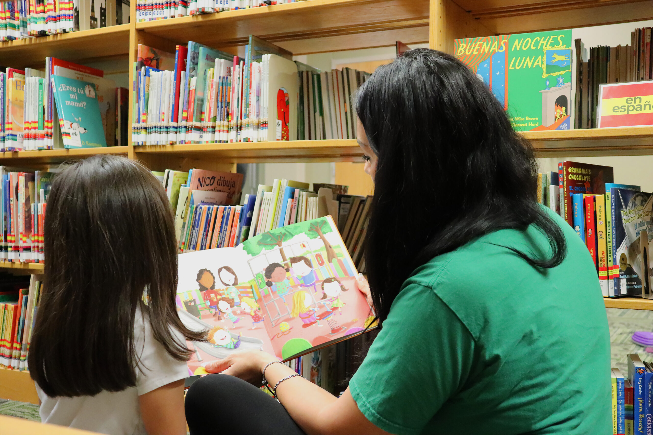 Ascension Parish Library; woman reading book with child