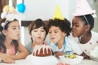 milestone birthdays; kids blowing out birthday candles