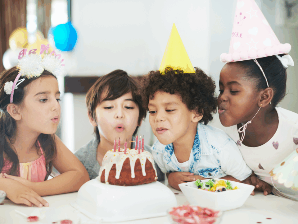 milestone birthdays; kids blowing out birthday candles