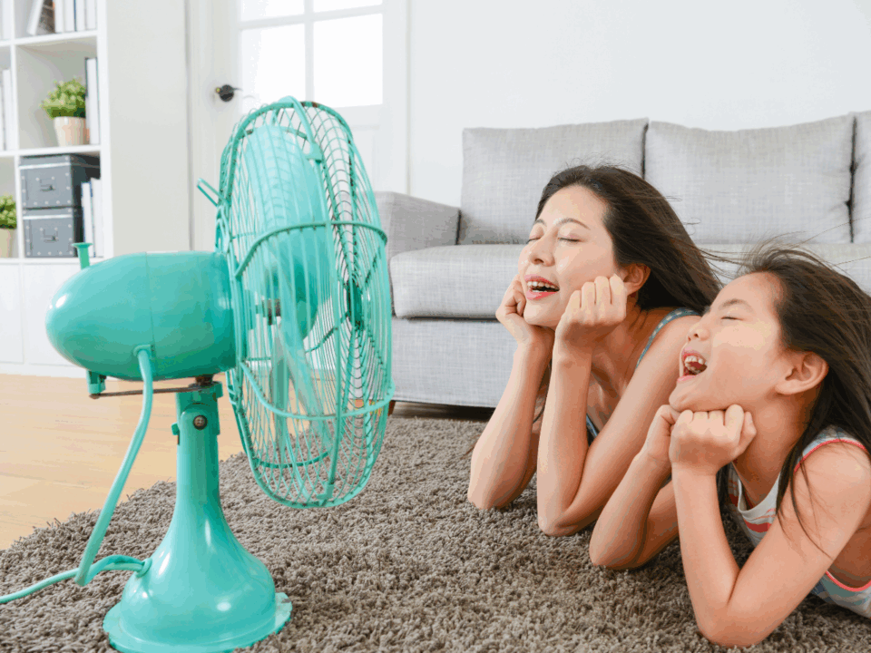 cool gear for hot days; woman daughter in front of fan