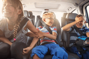 kids in car on family vacation
