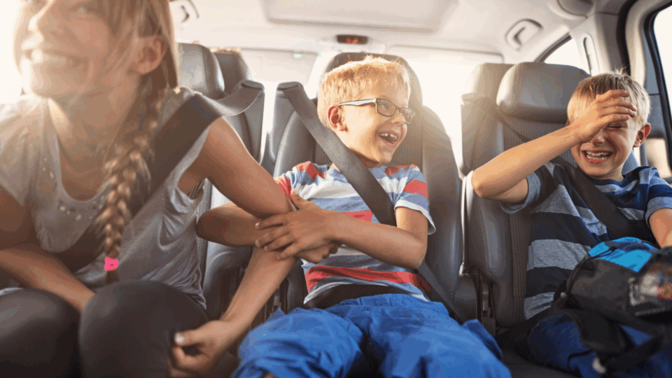 kids in car on family vacation