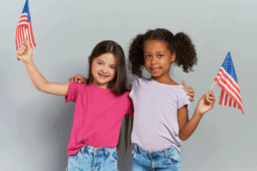 two girls holding american flags for patriotic crafts