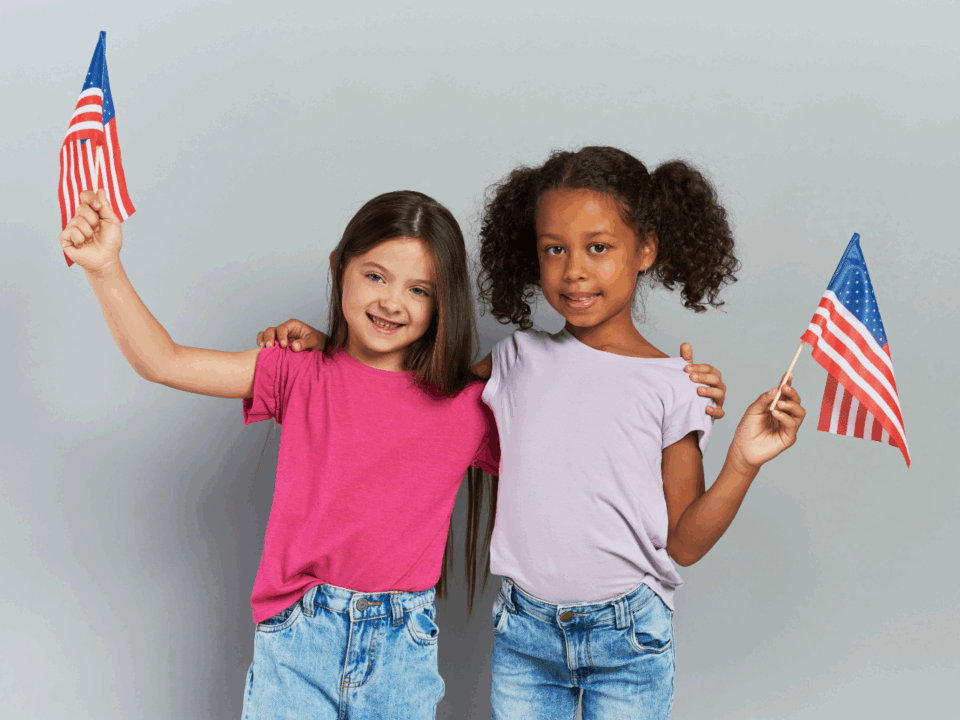two girls holding american flags for patriotic crafts