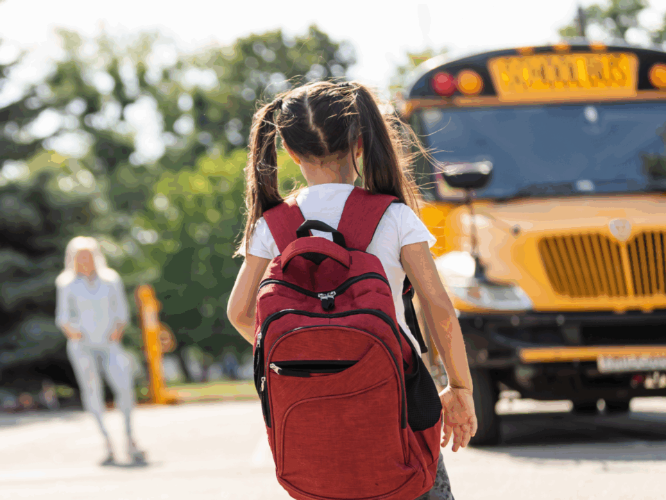 back to school giveaway; girl walking to bus
