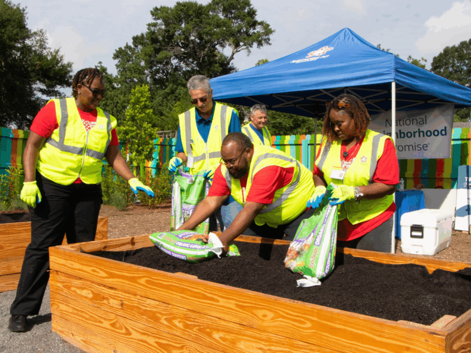 erie street park; volunteers working on garden