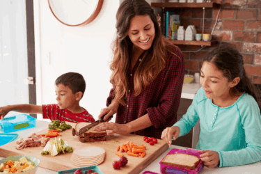 children packing school lunch with parent