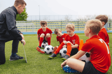 learning from losing; coach talking to soccer players