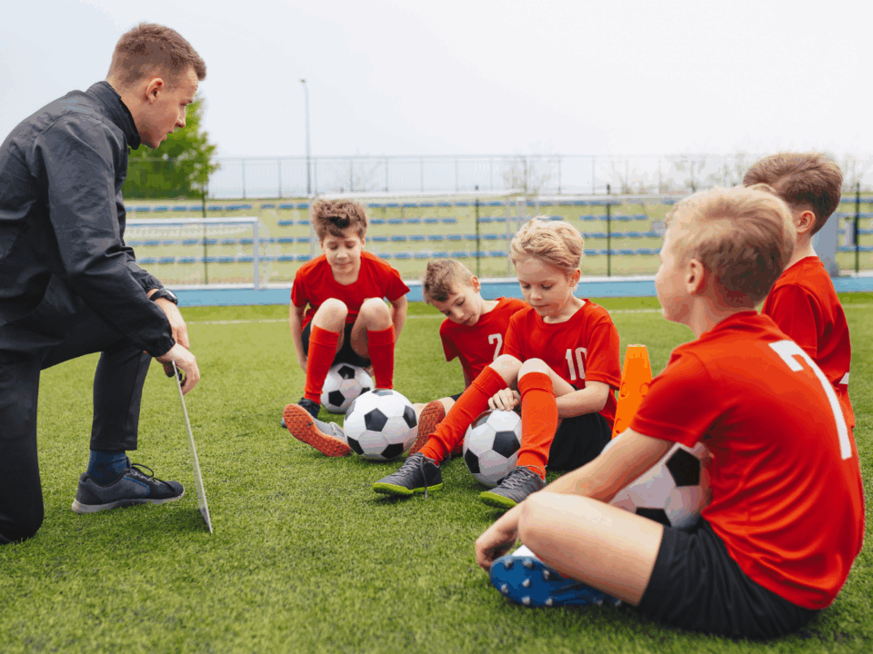 learning from losing; coach talking to soccer players