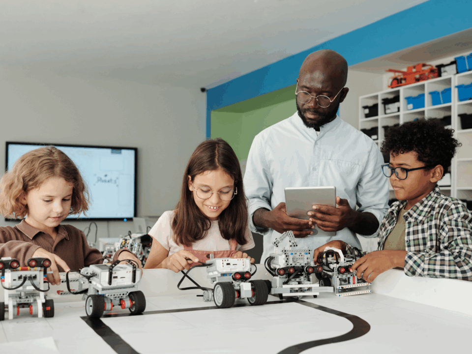 robotics; teacher working with students