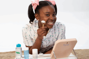 girl using face roller; skincare