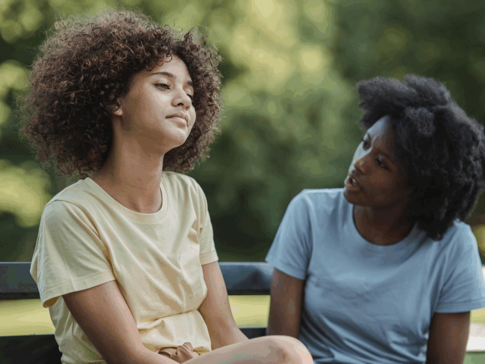 youth mobile crisis program; teen talking to adult outside