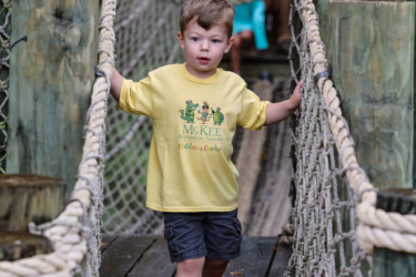 Vero Beach; child walking across rope bridge