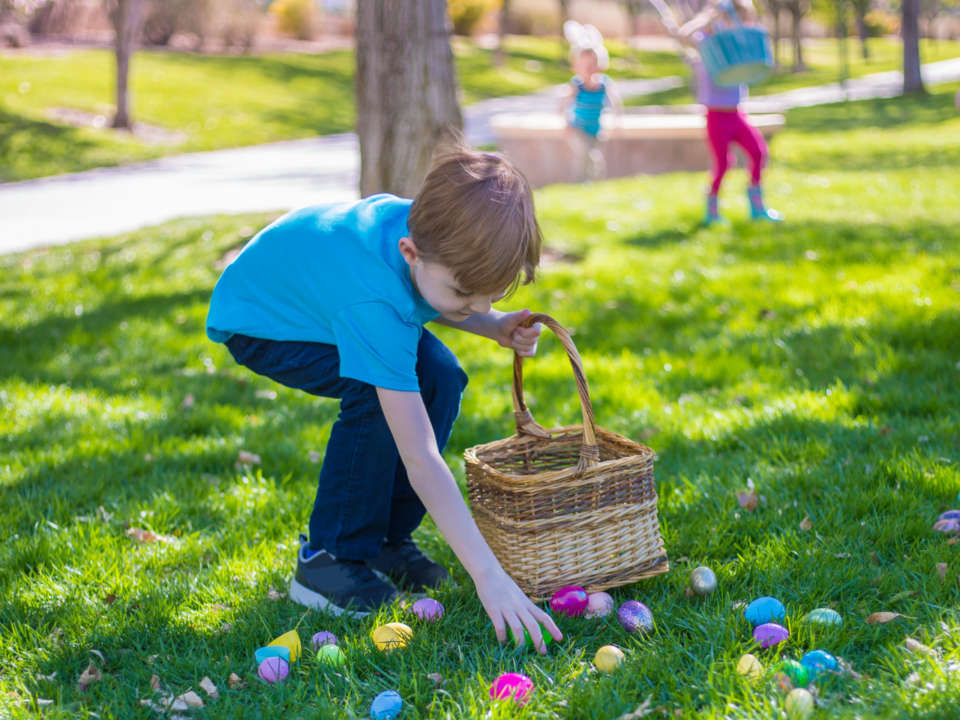 free family-friendly events; boy picking up easter eggs during a hunt