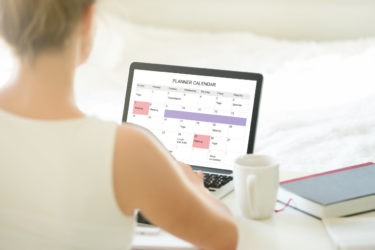 mom keeping family organized with digital calendar