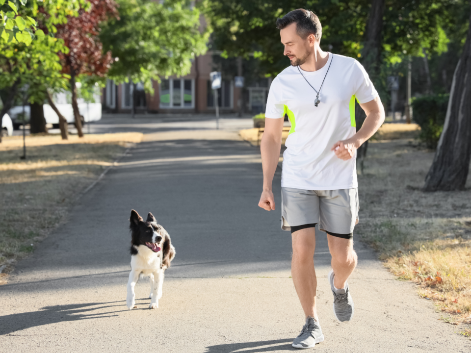 lsu vet med; man running with dog
